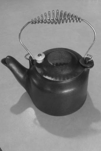 https://www.castironcollector.com/gallery/toys/wag_toy_tea_kettle1.jpg